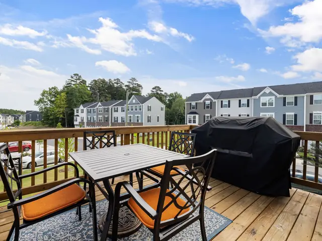 Clean wooden deck with patio furniture