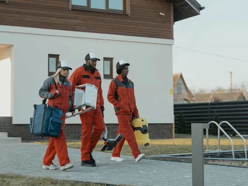 Tidy Pine cleaning team arriving at a home with supplies